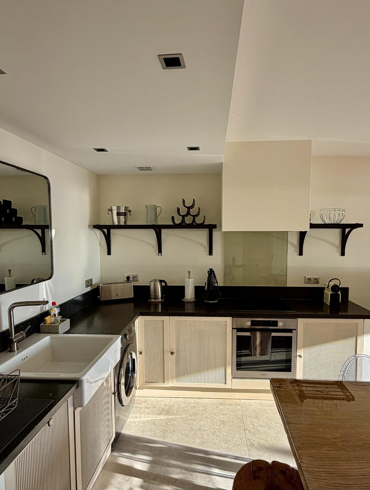 Kitchen with black countertops