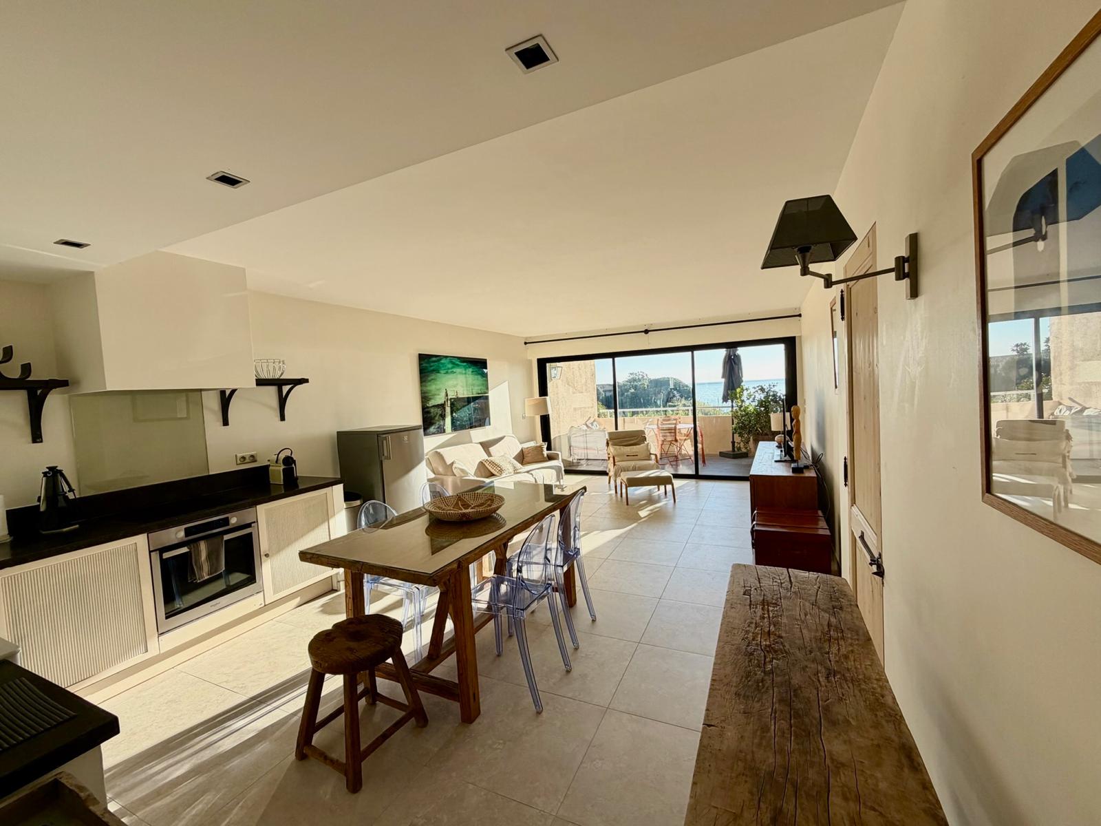 Open-plan living room with sea view